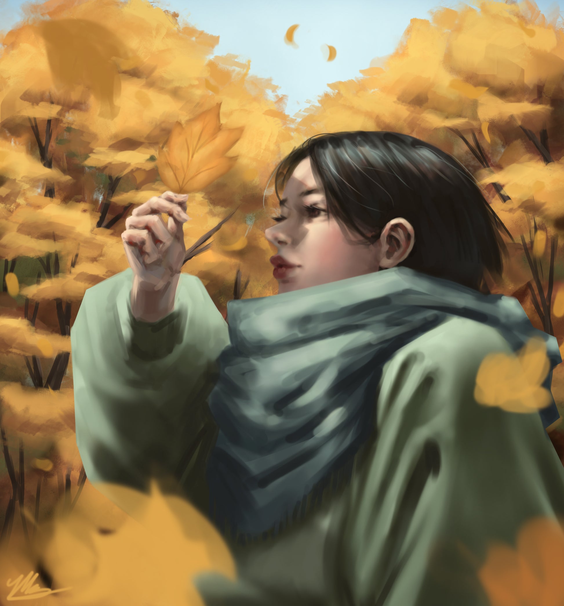 A portrait of a girl in autumn holding a leaf up to her face.